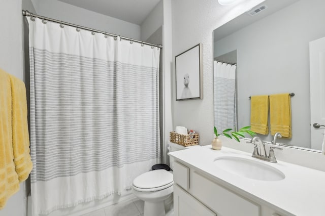 full bathroom featuring tile patterned flooring, vanity, toilet, and shower / bath combo