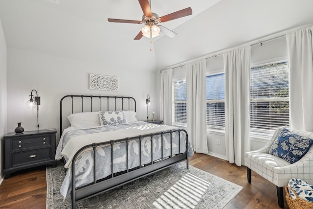 bedroom with dark hardwood / wood-style floors, ceiling fan, and lofted ceiling