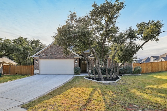 view of front of house with a front yard and a garage