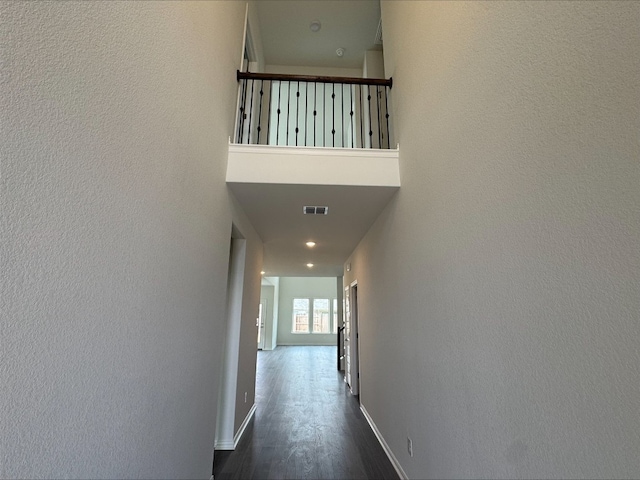 hallway featuring dark hardwood / wood-style flooring