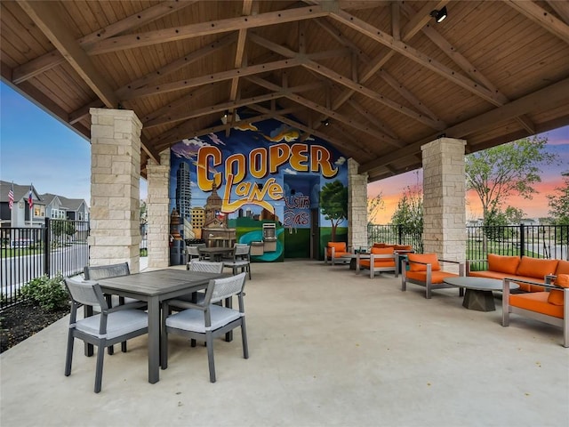 706 Terrier Trl, Austin, TX 78745 - patio terrace at dusk with outdoor lounge area, a patio, and outdoor dining space