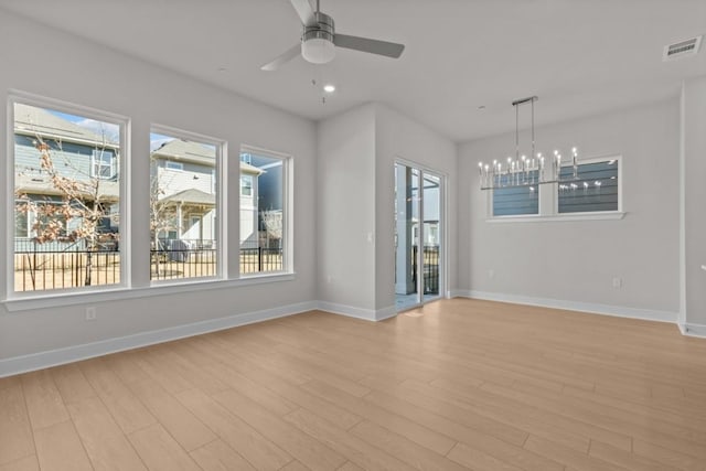 706 Terrier Trl, Austin, TX 78745 - empty room featuring light wood-type flooring, ceiling fan, a chandelier, and recessed lighting