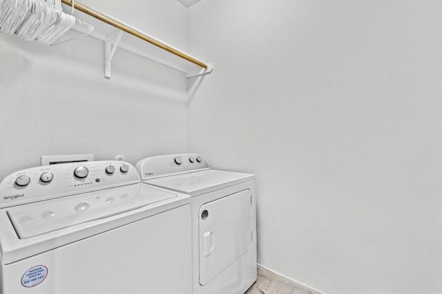 laundry room featuring washing machine and clothes dryer