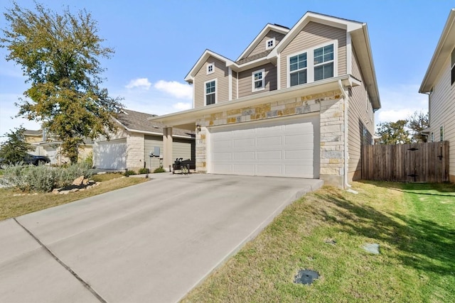 view of front of home with a front yard and a garage