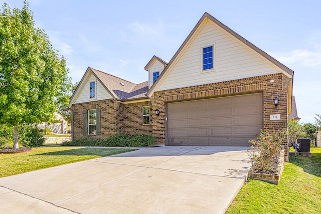 view of front of property with central AC and a front yard