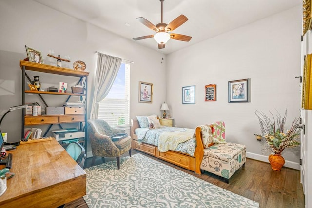 bedroom featuring dark wood-type flooring and ceiling fan