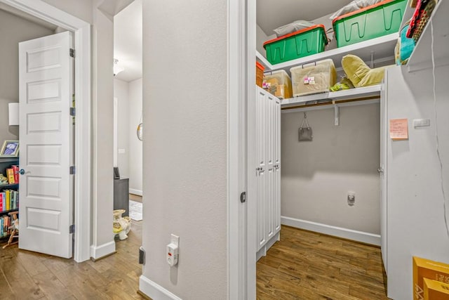 laundry area with hardwood / wood-style flooring