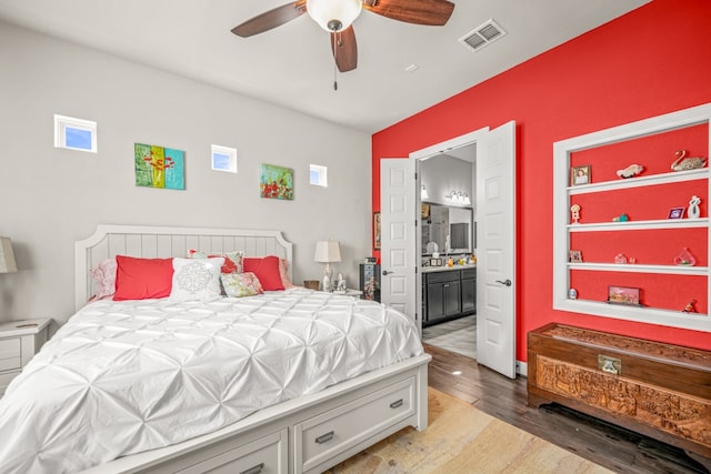 bedroom with ensuite bath, light hardwood / wood-style flooring, and ceiling fan