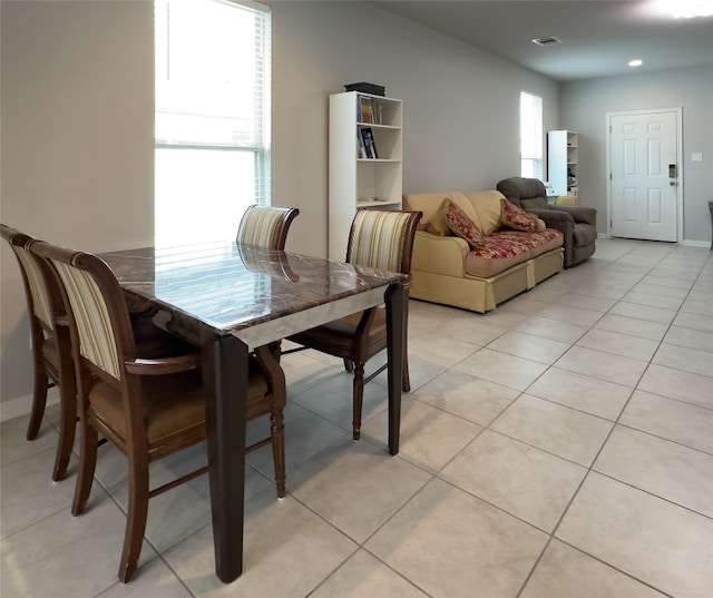 dining area featuring light tile patterned floors