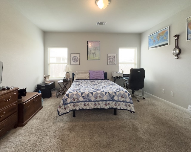 bedroom with light carpet