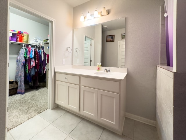 bathroom featuring tile patterned flooring and vanity