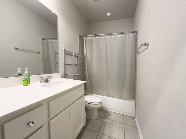 full bathroom with toilet, vanity, tile patterned floors, and shower / bath combo with shower curtain