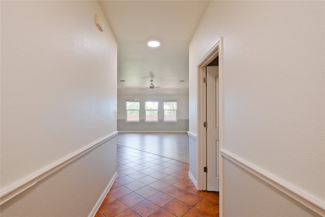 hall featuring light tile patterned flooring