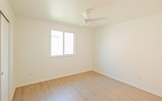 empty room with light hardwood / wood-style flooring and ceiling fan