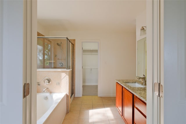 bathroom with vanity, tile patterned floors, and separate shower and tub