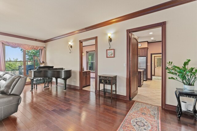 living room featuring dark hardwood / wood-style flooring and crown molding