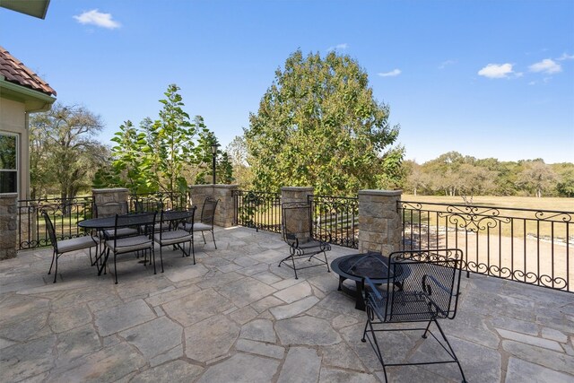 view of patio / terrace featuring a fire pit