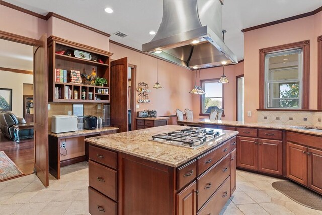 1092 Fm 3000, Elgin, TX 78621 - kitchen featuring ornamental molding, a kitchen island, decorative backsplash, open shelves, and stainless steel gas stovetop