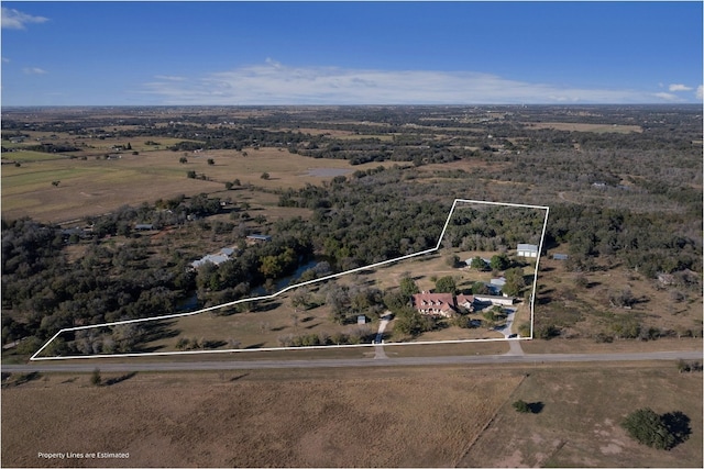 birds eye view of property with a rural view