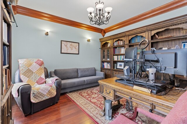 office with a chandelier, dark wood-type flooring, and ornamental molding