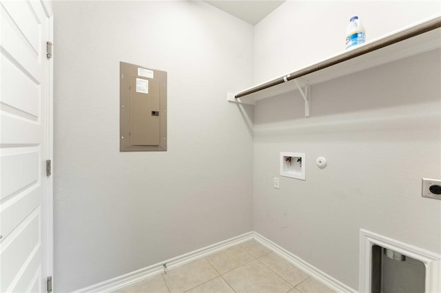 clothes washing area featuring hookup for a washing machine, electric dryer hookup, light tile patterned floors, electric panel, and hookup for a gas dryer