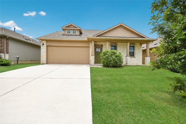 view of front of house featuring a garage and a front lawn