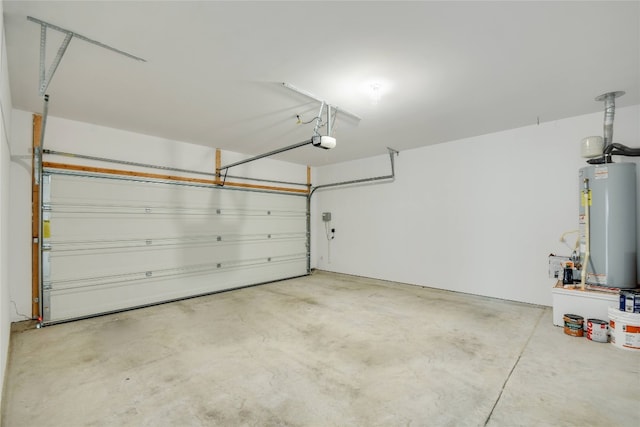 garage featuring a garage door opener and water heater