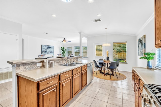 kitchen featuring ceiling fan, sink, lofted ceiling, decorative light fixtures, and appliances with stainless steel finishes