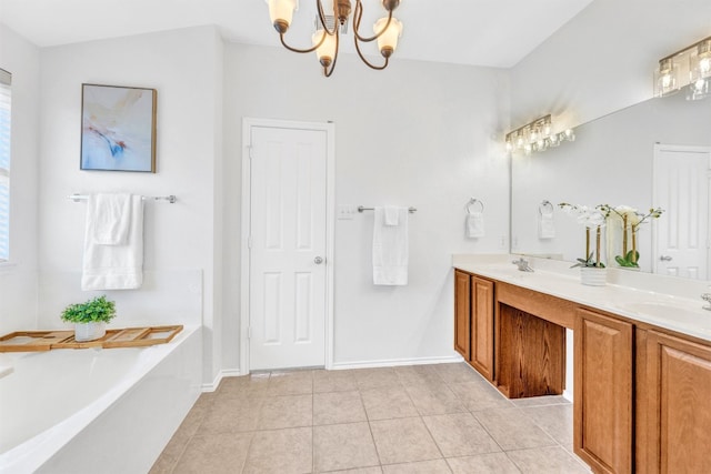 bathroom featuring tile patterned floors, a tub, vanity, and a chandelier