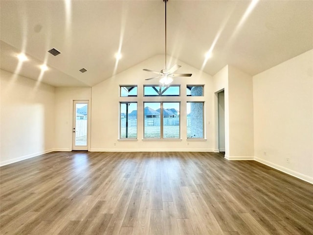 unfurnished living room with dark wood-type flooring, baseboards, visible vents, and ceiling fan