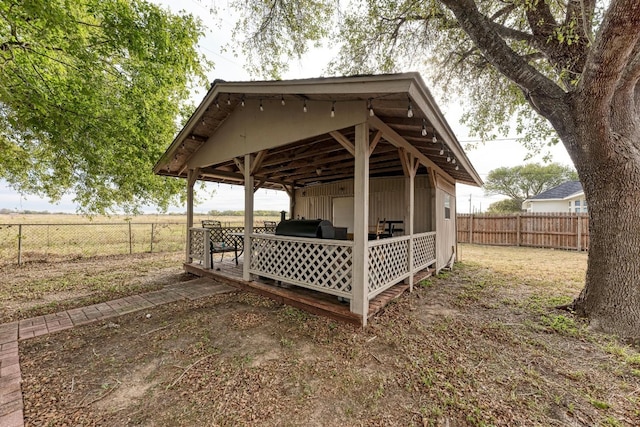 exterior space featuring a rural view and grilling area