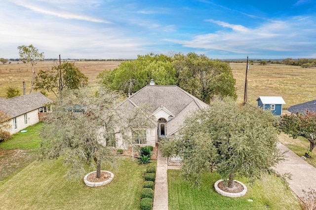 birds eye view of property featuring a rural view