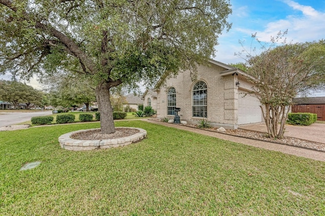 view of front of home featuring a garage and a front lawn