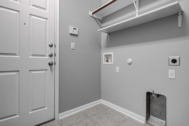 laundry area featuring hookup for an electric dryer, hookup for a gas dryer, light tile patterned floors, and hookup for a washing machine