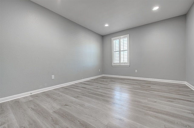 unfurnished room featuring light hardwood / wood-style flooring