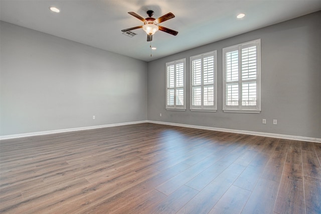 spare room featuring ceiling fan and hardwood / wood-style floors