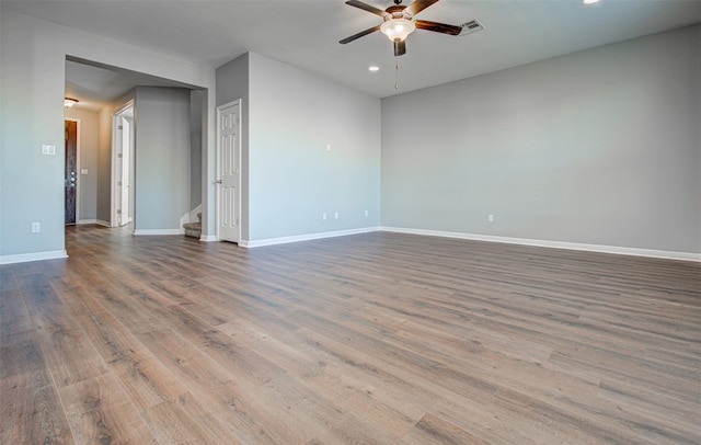 unfurnished room featuring ceiling fan and hardwood / wood-style floors