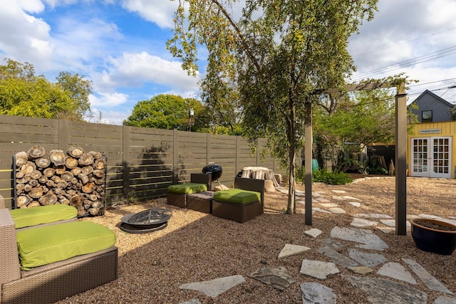 view of yard featuring an outdoor fire pit