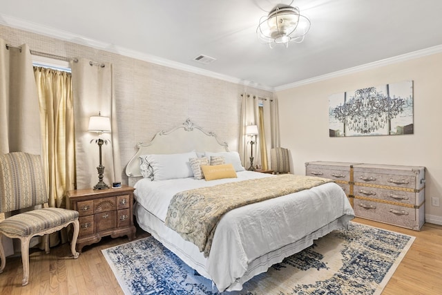 bedroom featuring ornamental molding and wood-type flooring