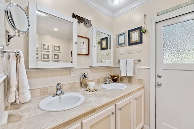 bathroom with crown molding and vanity