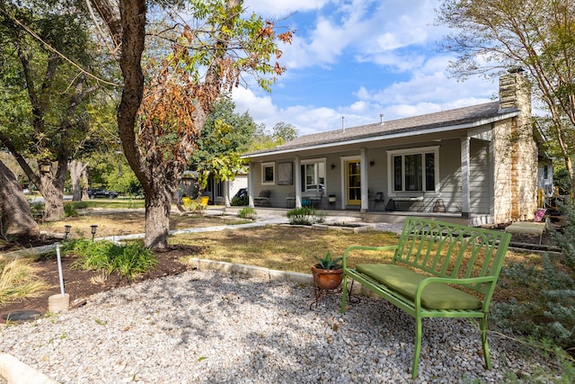 back of property featuring a porch