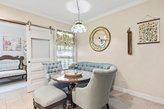 dining space with ornamental molding, a barn door, and light tile patterned flooring