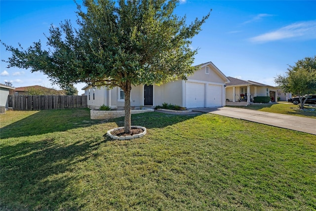 view of front of home with a garage and a front yard