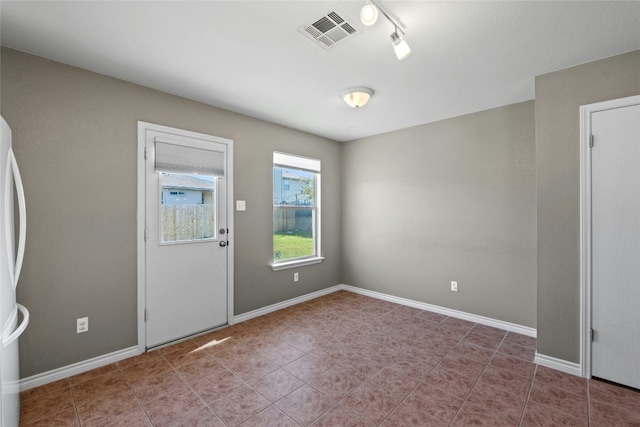 view of tiled spare room