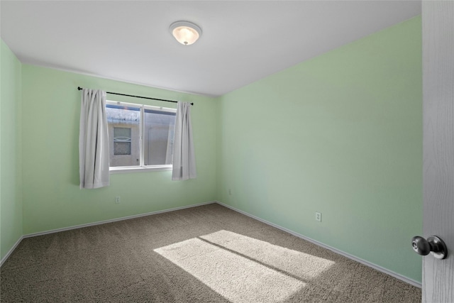 spare room featuring carpet floors