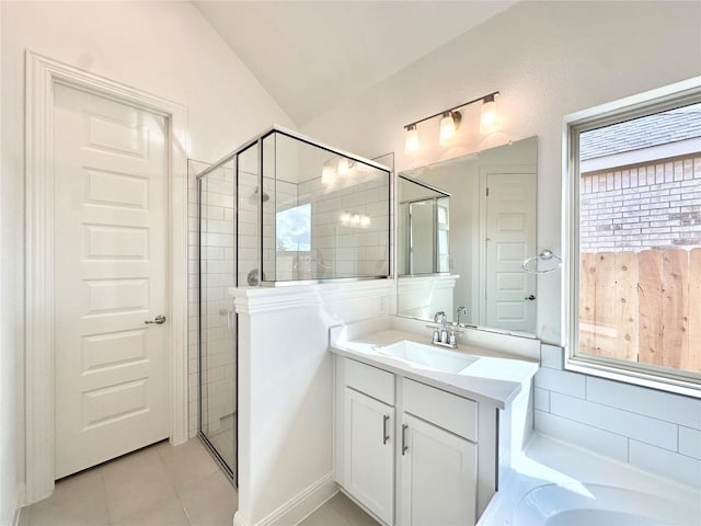 bathroom with shower with separate bathtub, vanity, tile patterned floors, and lofted ceiling