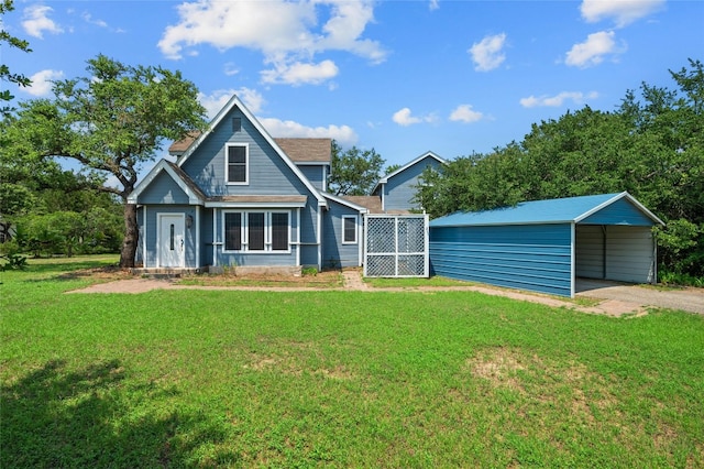 rear view of house with a yard and a carport