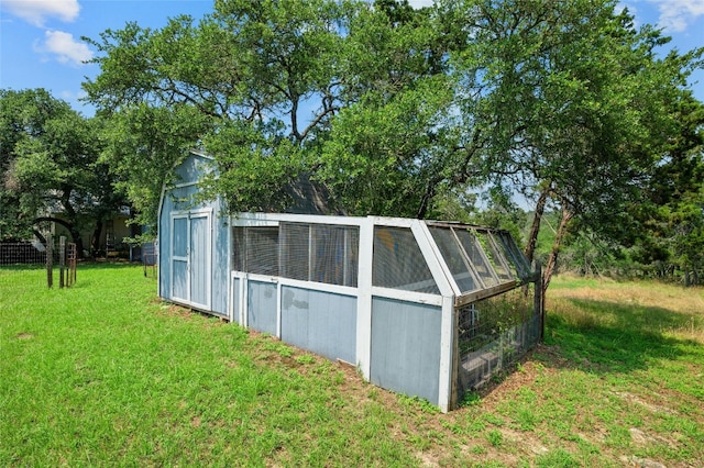 view of outdoor structure with a lawn