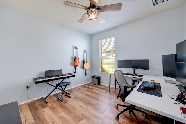 office space featuring light hardwood / wood-style flooring and ceiling fan