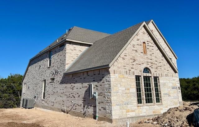 view of home's exterior with central AC unit